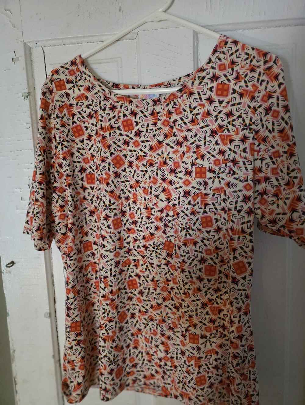 LuLaRoe Geometric Print Crew Neck Top in Coral, Black, Cream